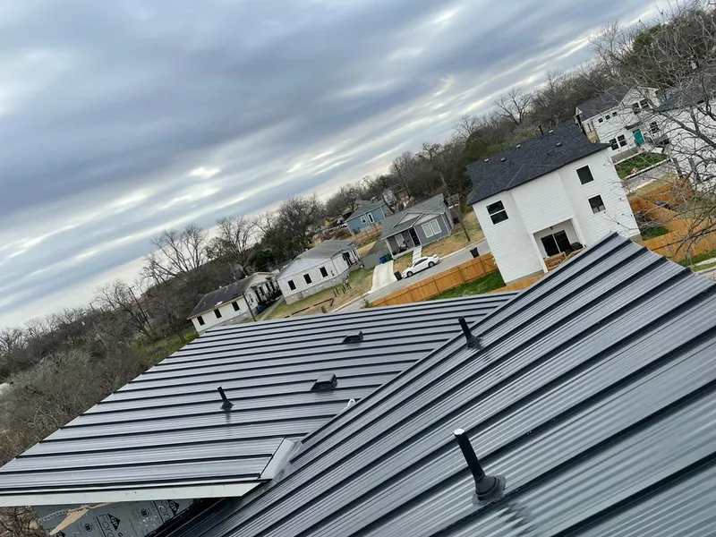 Standing seam metal roof panels with vents for Skylight Repair in University Heights